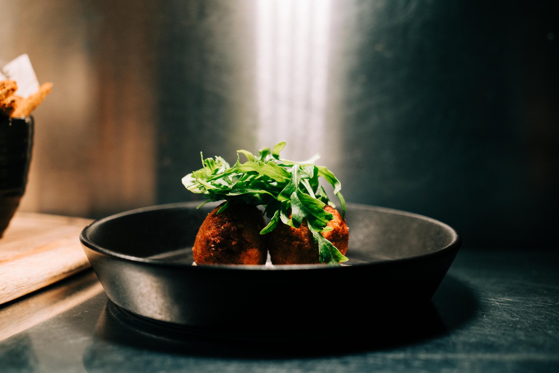 A dressed starter in a black bowl at The Kings Arms